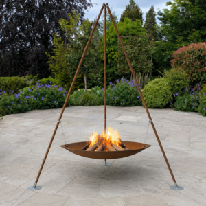 AK47 Tripee fire pit with flames licking within the fire bowl