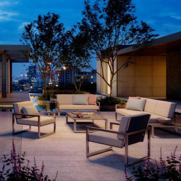 Nighttime image of Royal Botania Ninix Lounge minimalist garden furniture on rooftop terrace