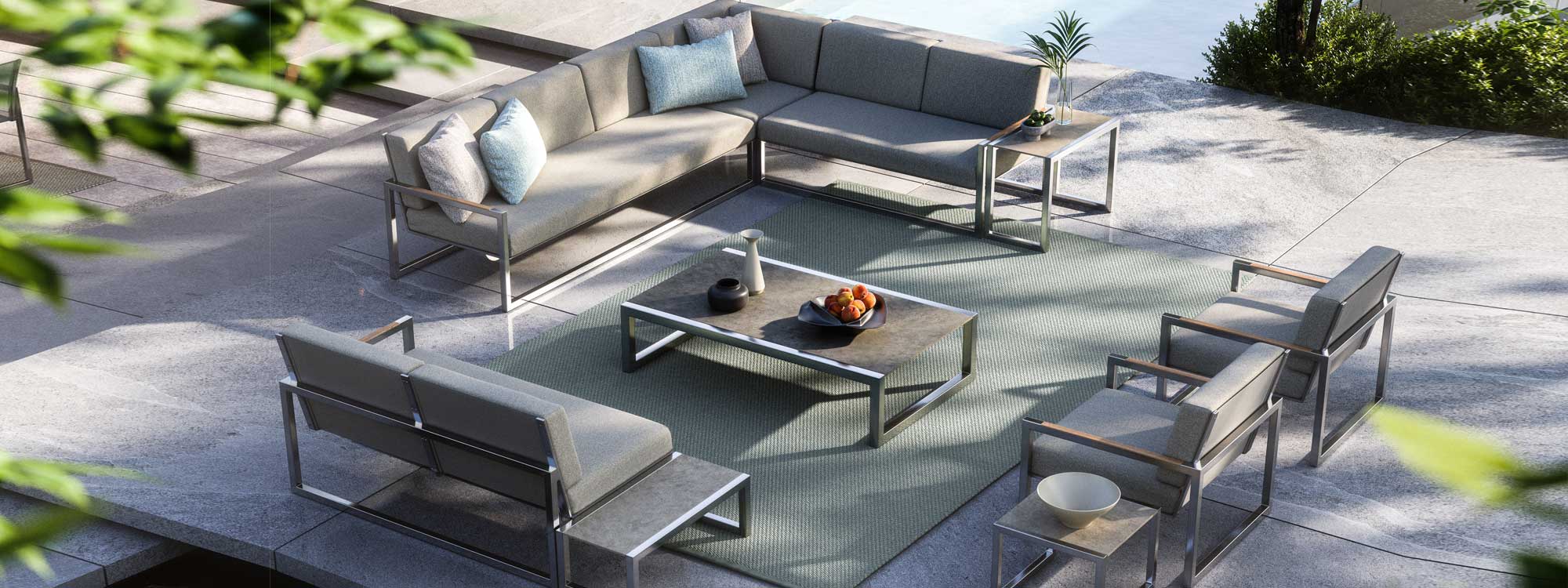 Image of aerial view of Ninix Lounge modern garden corner sofa, stainless steel lounge chairs and ceramic low tables by Royal Botania
