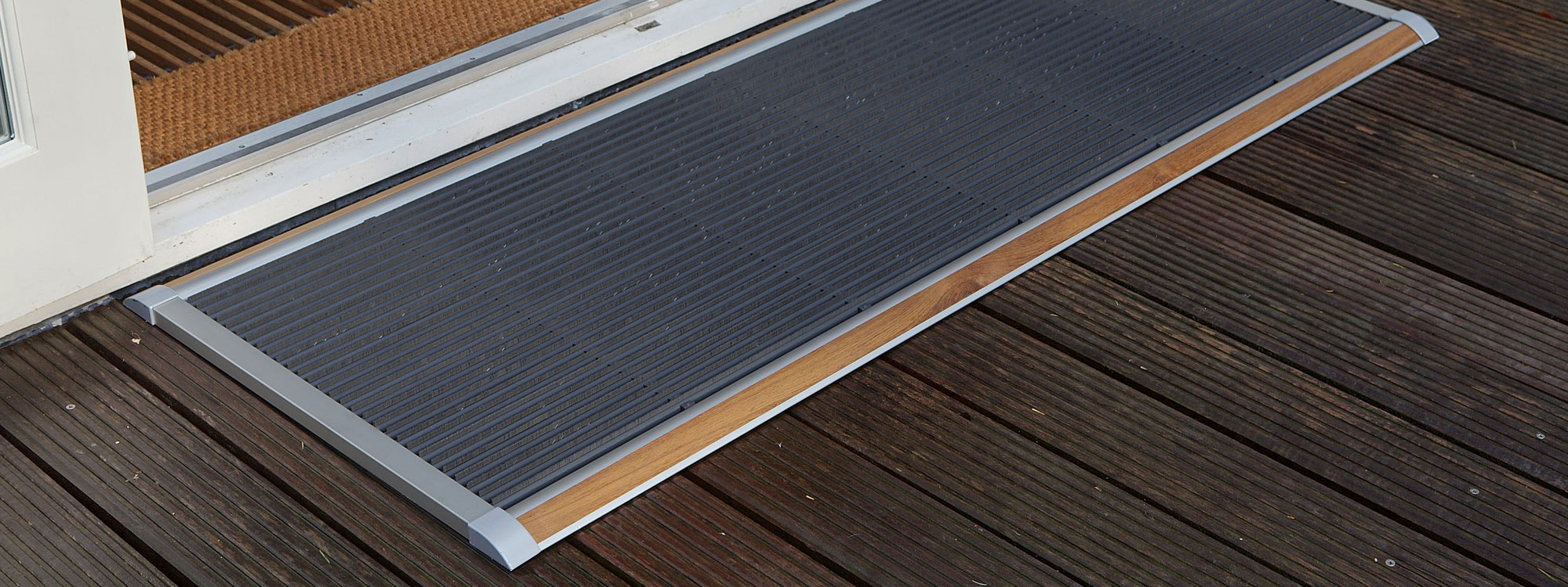Image of RiZZ The New Standard modern door mat with anodized silver aluminium frame with teak inlay