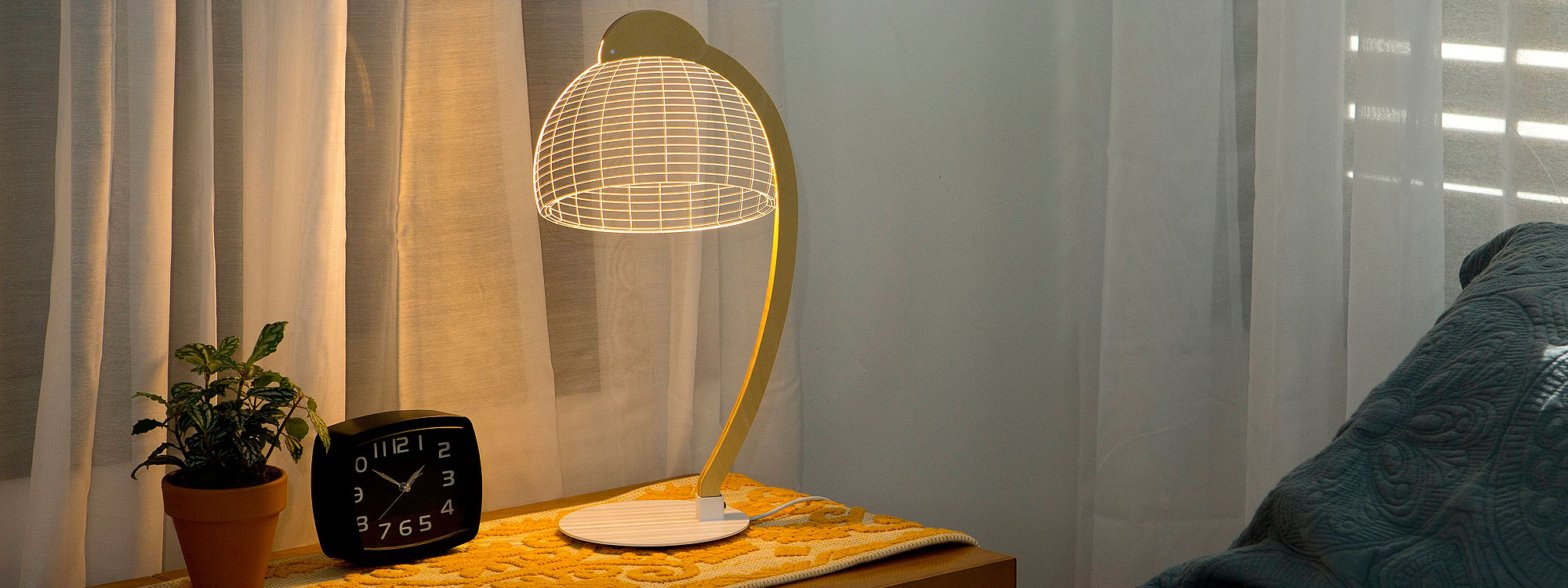 Image of illuminated Dome LED desk light which magically transforms from 2D to 3D by Studio Cheha