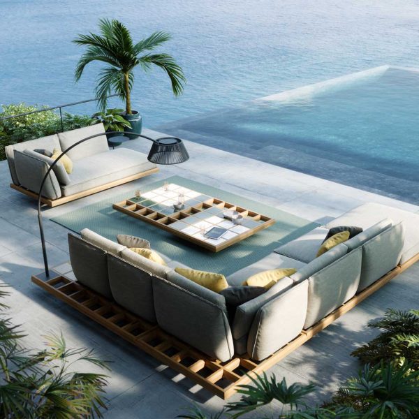 Image of aerial view of Mozaix modern teak corner sofa with swimming pool, palm tree and coastline in the background