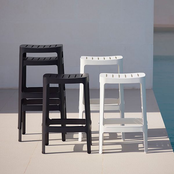 Image of black and white aluminum garden bar chairs by Cane-line