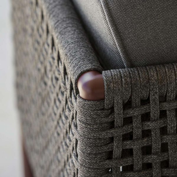 Image of detail of dark grey Soft Rope weave and Bordeaux aluminium frame of Cane-line Encore garden sofa