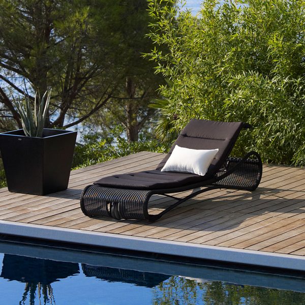 Image of Escape contemporary sunbed in black Cane-line weave with black cushion