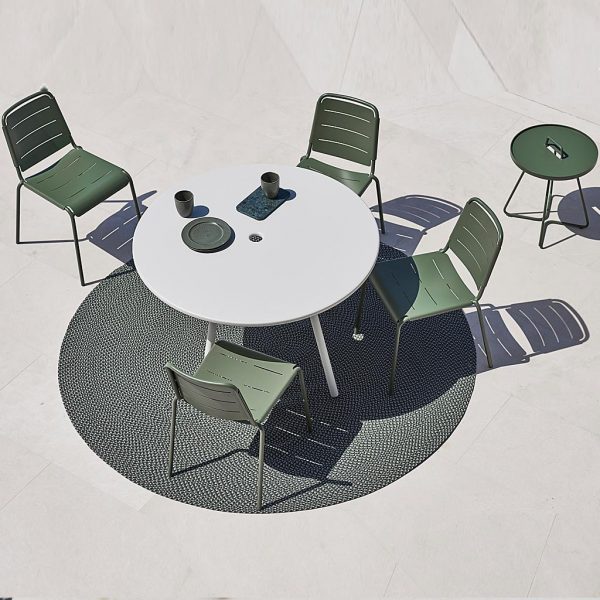 Image of aerial view of olive-green Copenhagen aluminum chairs and white Area round garden table by Cane-line