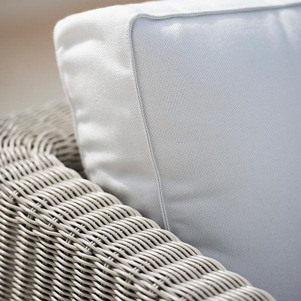 Image of detail of taupe Cane-line weave and White Cane-line Natté cushions used for Connect modular garden sofa