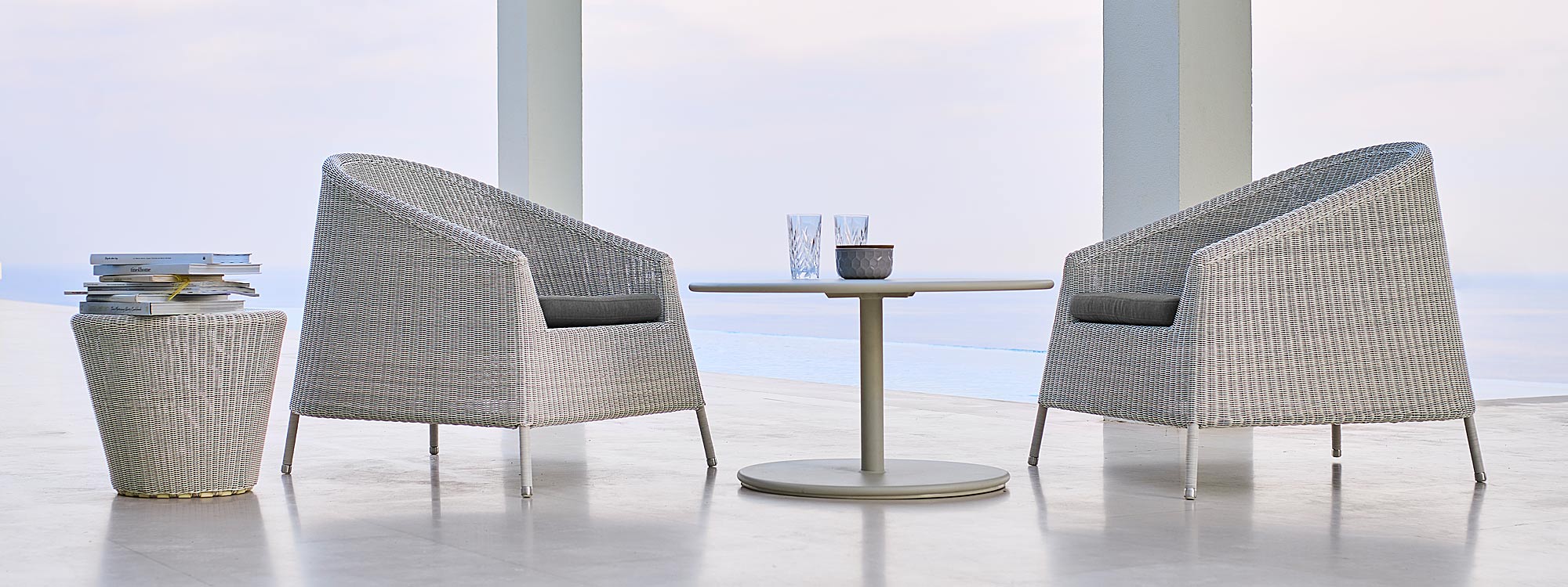 Image of pair of White-grey Kingston stacking garden lounge chairs and white Go coffee table by Cane-line