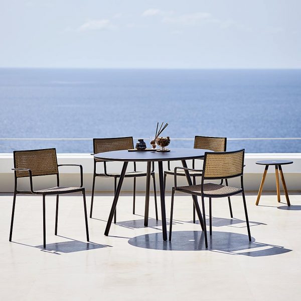 Less modern garden chair is a minimalist outdoor carver chair in luxury garden furniture materials by Cane-line all-weather garden furniture.