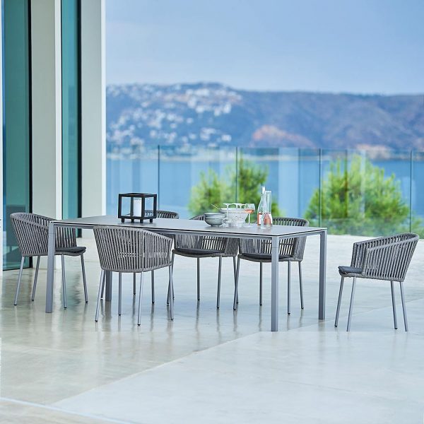 Image of grey Pure rectangular garden table and grey Moments dining chairs by Cane-line