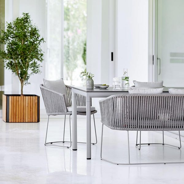 Moments modern garden dining chair is a designer outdoor carver chair in luxury garden furniture materials by Caneline furniture company.