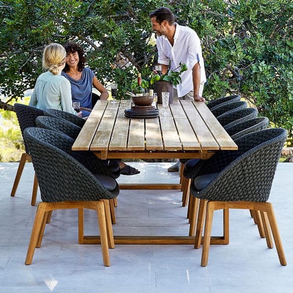 Peacock woven garden dining chair is a modern garden furniture chair in all-weather furniture materials by Cane-line luxury outdoor furniture