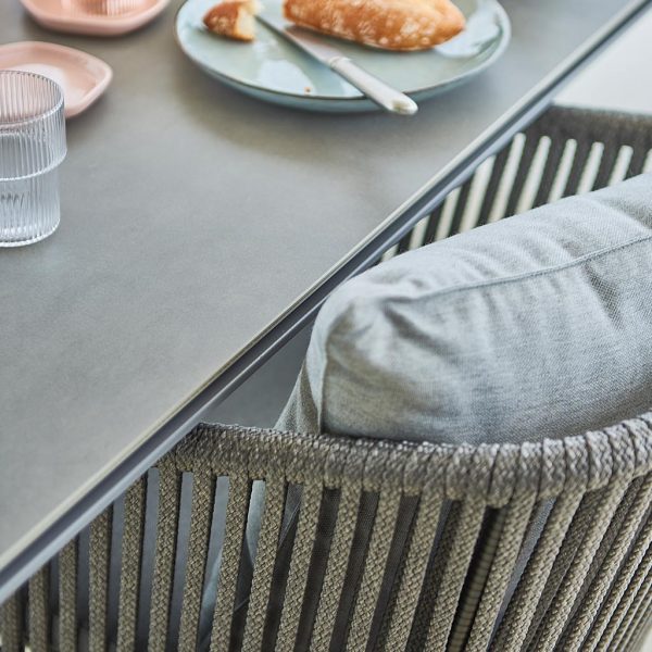 Image of Pure light grey dining table and light grey Moments rope chair by Caneline