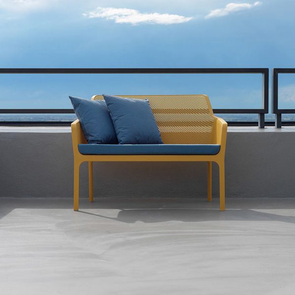 Image of Nardi Net stacking garden sofa bench in mustard coloured polypropylene with blue cushions