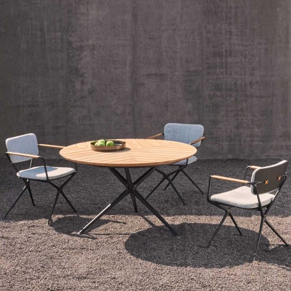 Image of Exes anthracite table with teak top and Exes chairs in anthracite with cream cushions in sun and shade by Royal Botania