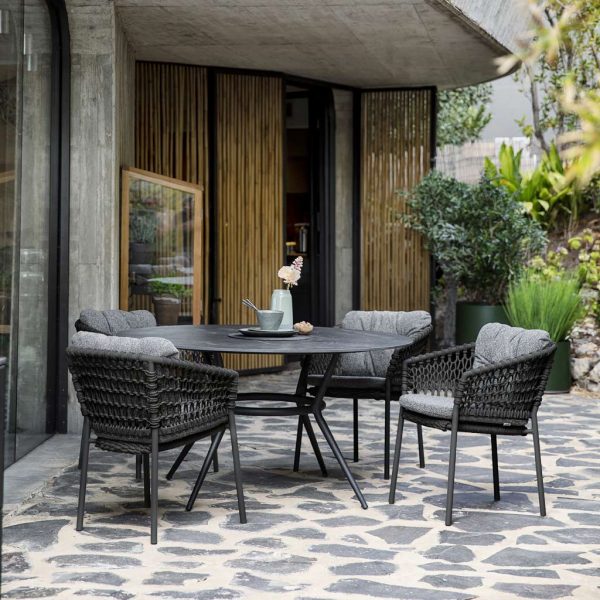 Joy garden table is a modern outdoor dining table - circular or rectangular garden table in high quality outdoor furniture materials by Cane-line furniture
