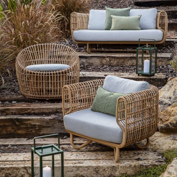 Image on 3 different levels showing Caneline Nest lounge chair, round lounge chair and 2 seat sofa in natural Cane-line Weave with Taupe cushions