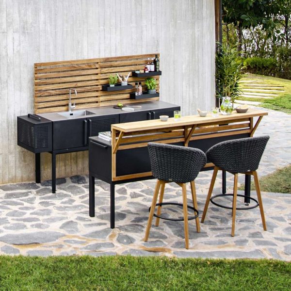 Image of Caneline Peacock garden bar chairs against Drop outdoor bar counter
