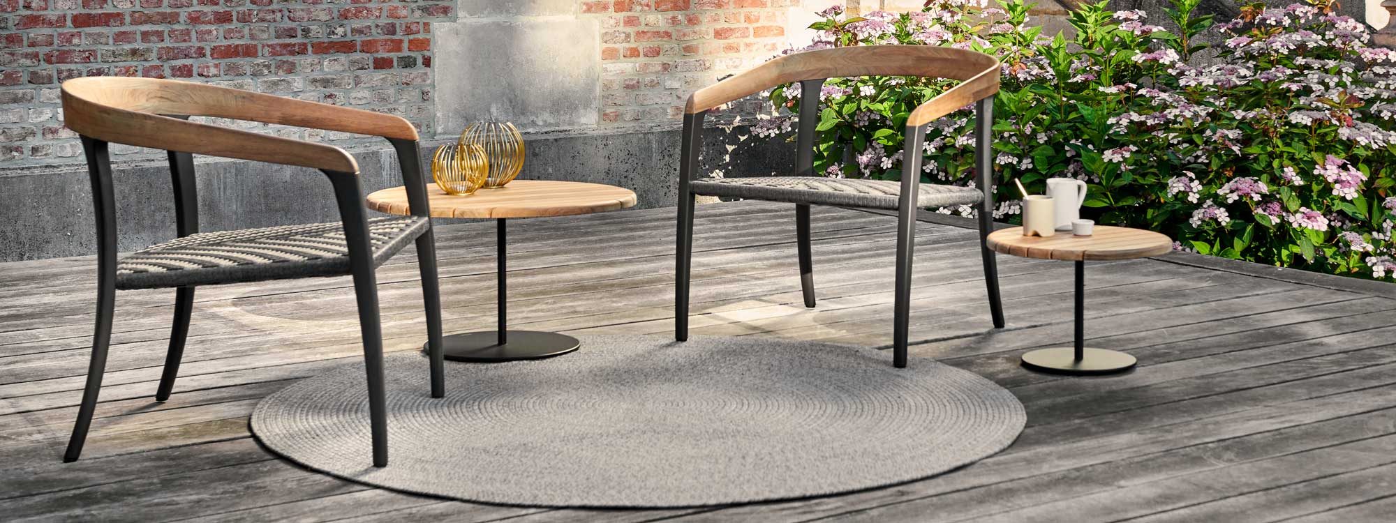 Image of Royal Botania Butler tables and Jive lounge chairs with anthracite frames and teak detail