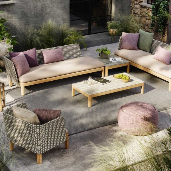 Image of Royal Botania Calypso lounge furniture with Rose-coloured upholstery in dappled sunlight on terrace