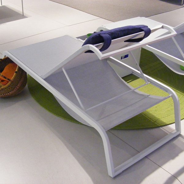 Image of Coro L3 white sun lounger, showing storage space beneath the adjustable backrest