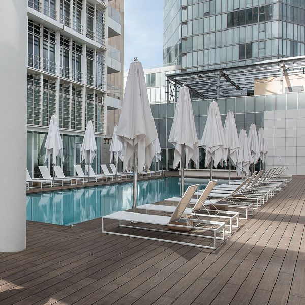 Image of FueraDentro contemporary white sun loungers around Israeli hotel poolside