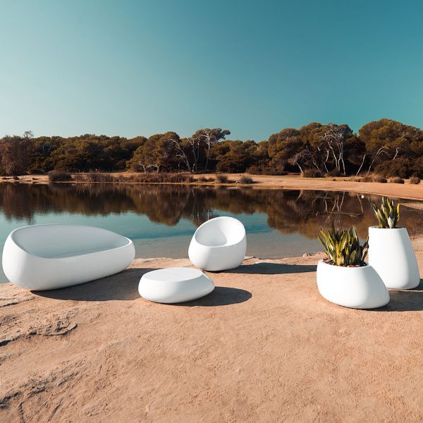 Image of Stone modern roto-molded outdoor furniture by Vondom on sandy, arid lakeside