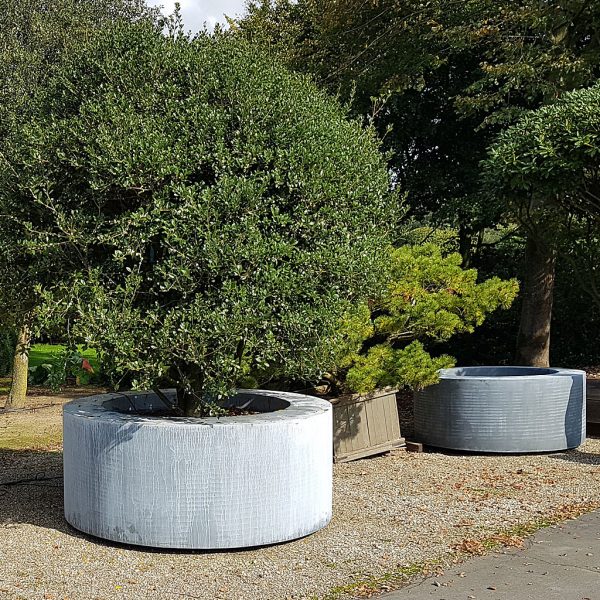 Image of large round brass planters in weathered finish by LVIV