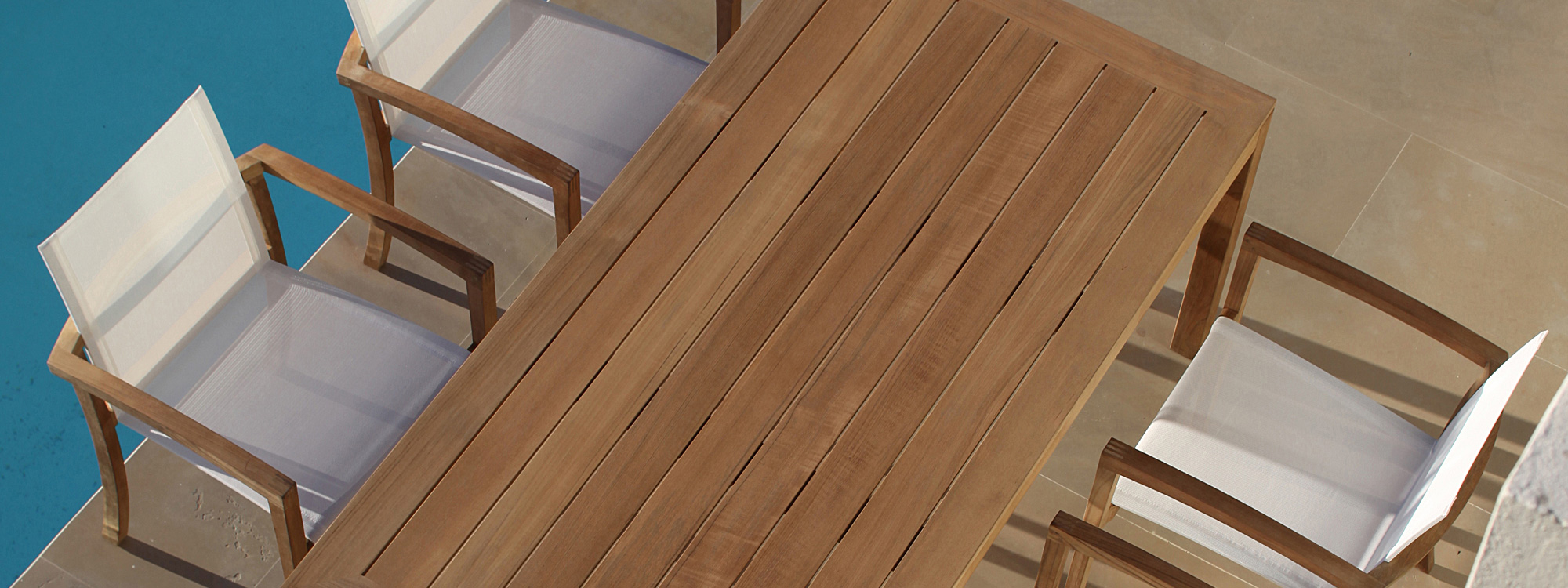 Birdseye view of XQI 55 carver chair & teak planks for XQI dining table by Royal Botania