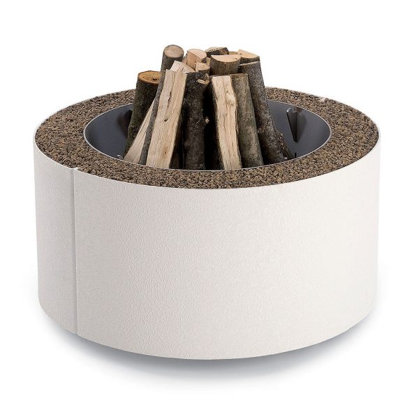Studio image of white Mangiafuoco fire pit by AK47 Design, loaded with firewood ready to light