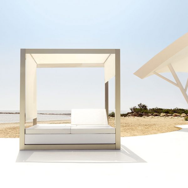 Image of Vondom Vela modern square daybed and pergola with blinds on sunny terrace