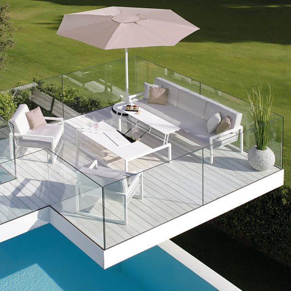 Image of white Palma parasol and Ninix compact garden sofa on small terrace by Royal Botania