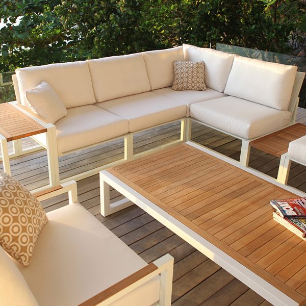 White Ninix corner sofas with teak table from Encompass modern garden furniture company