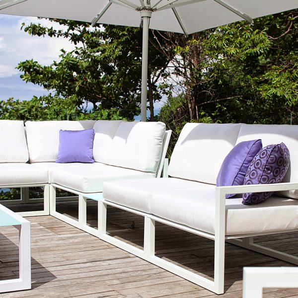 Ninix white outdoor sofas and white Shady parasols by Royal Britania