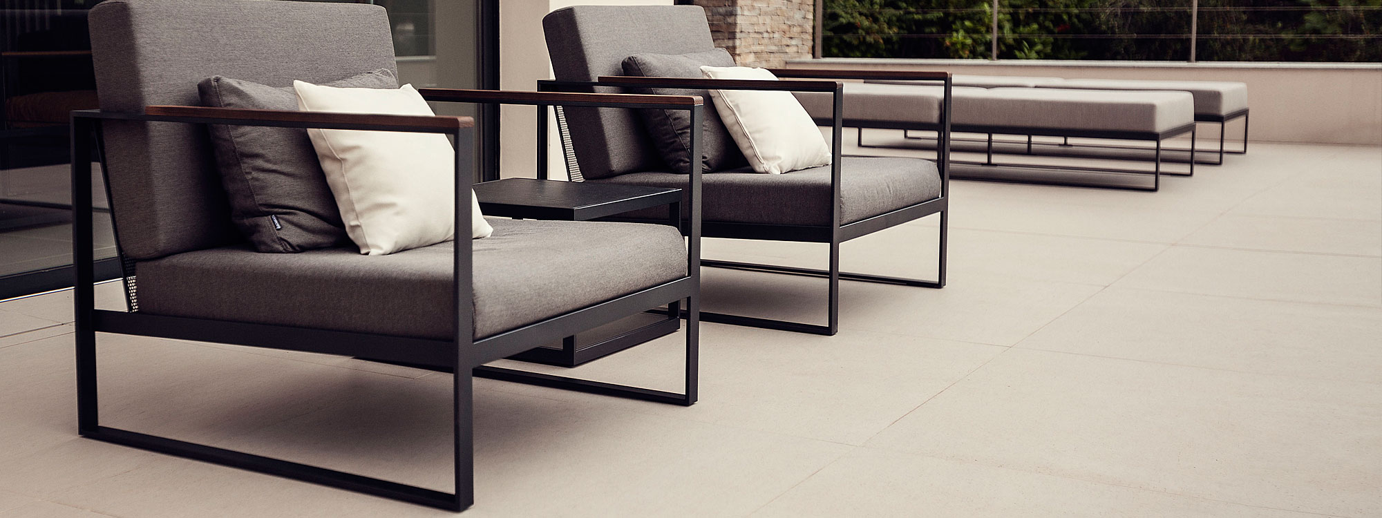 Image of pair of Roshults Garden Easy lounge chairs and daybeds on sleek terrace