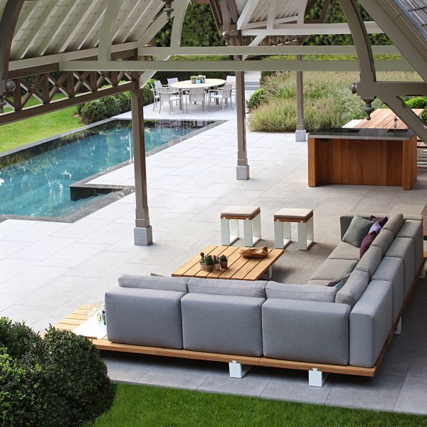 Image of birds eye view of Royal Botania Vigor Lounge teak corner sofa with grey upholstery in stylish pool house