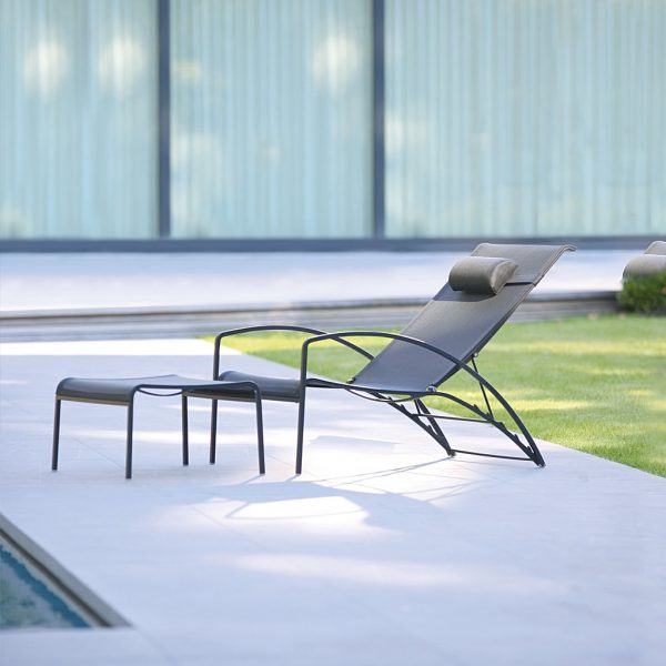 Image of black QT195 adjustable relax chair and footstool by Royal Botania on poolside