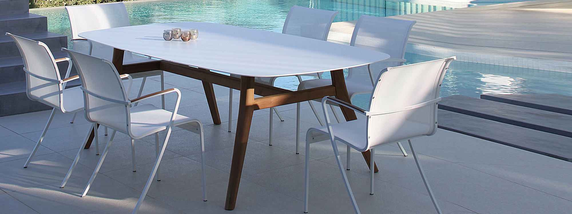 Image of white QT55 chair & Zidiz table with teak legs and white ceramic top by Royal Botania