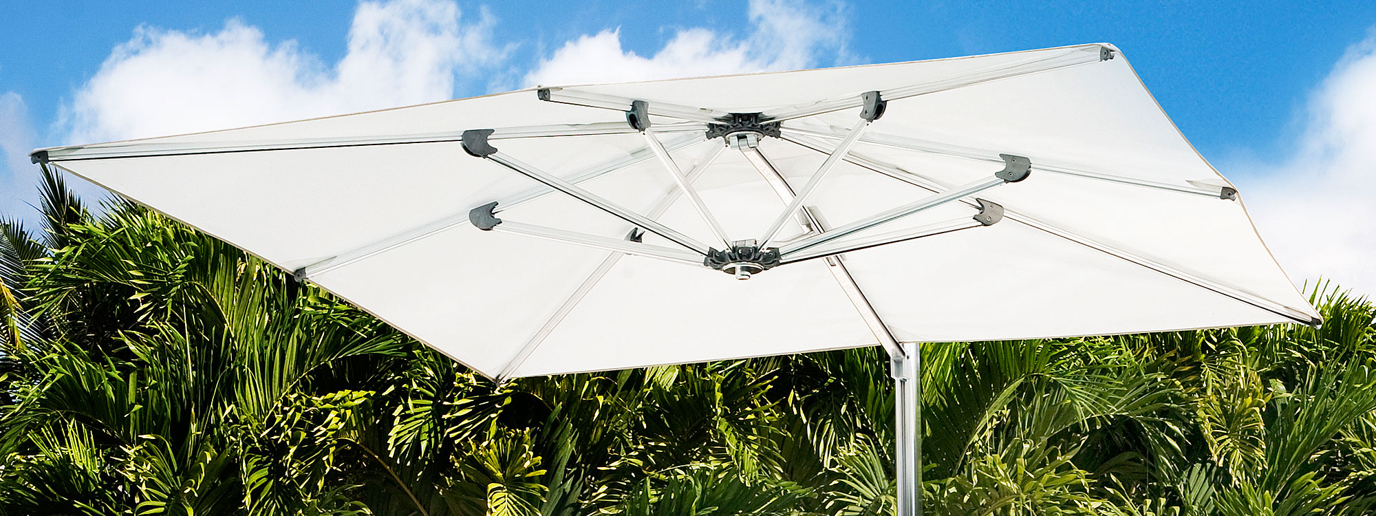 Image of Ocean Master Max square cantilever parasol with white canopy and polished titanium mast and ribs