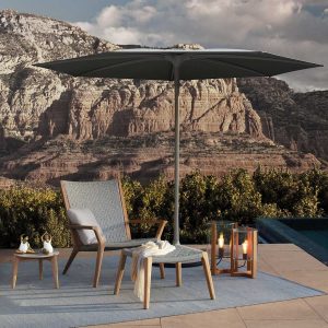 Palma Parasol & Vita garden lounge chair by Royal Botania on terrace with mountains in background