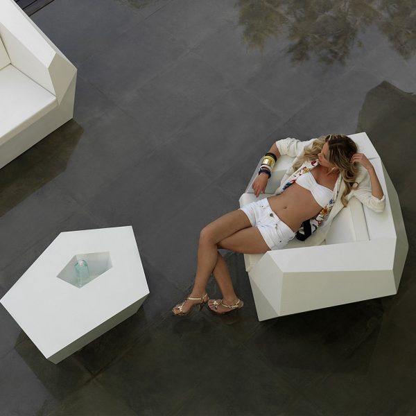 Image of woman lying back in Vondom Faz modern white garden chair