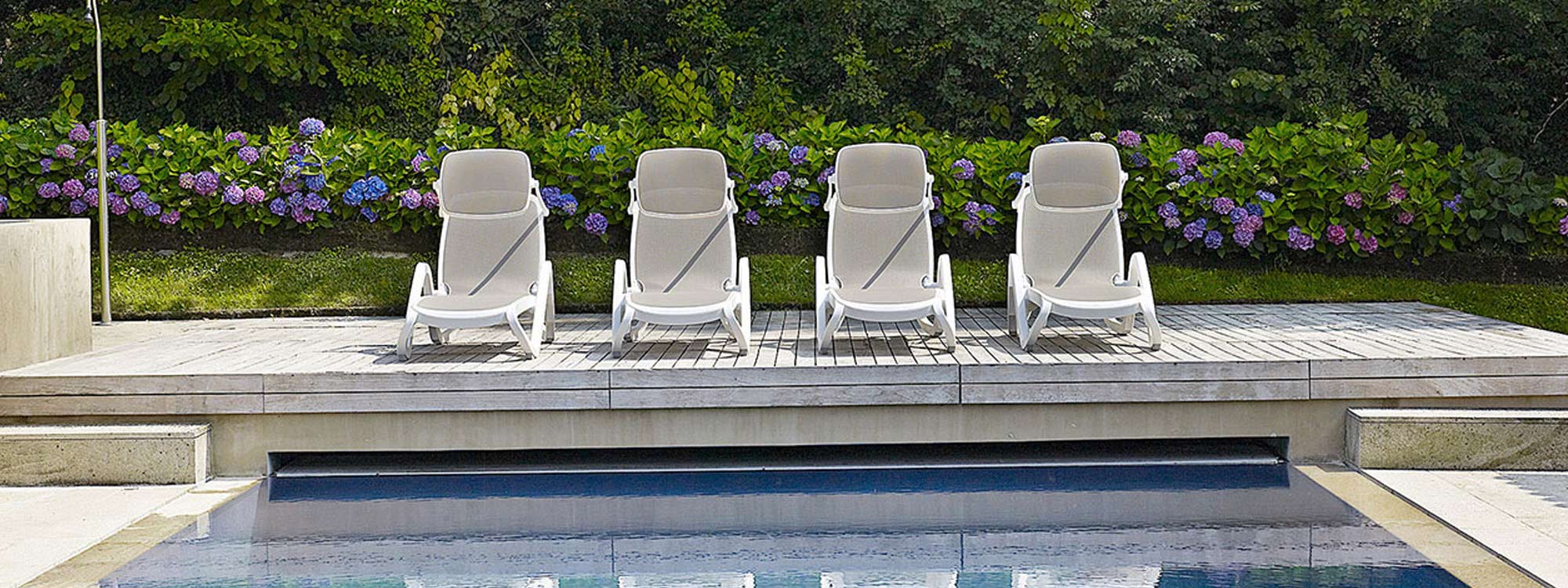 Row Of White Alpha HOTEL SUN LOUNGER Is A STACKING Contract Sunbed In HIGH QUALITY Outdoor Furniture MATERIALS By Nardi MODERN Hospitality FURNITURE - Italy.