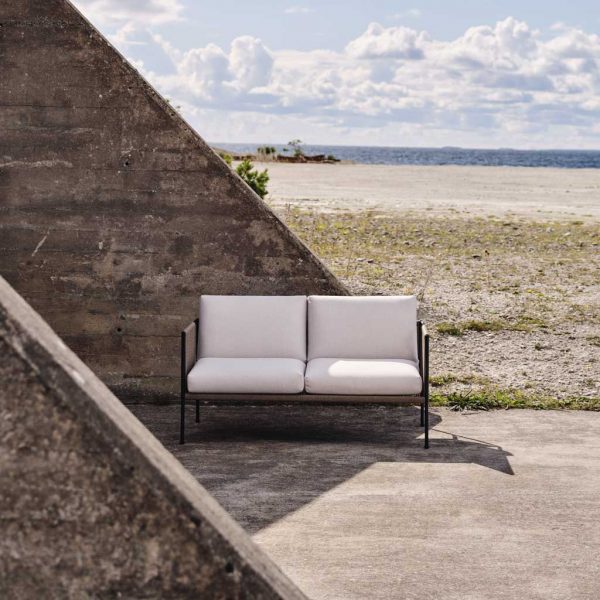 Image of Antibes 2 seater garden sofa outside chic bomb shelter