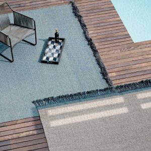 Image of Harp chair and Atlas outdoor rugs on wooden decking