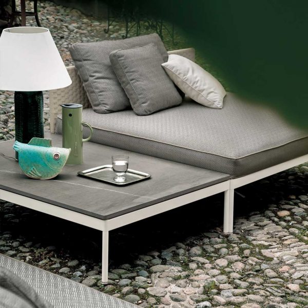 Image of Basket outdoor low table directly next to Basket daybed