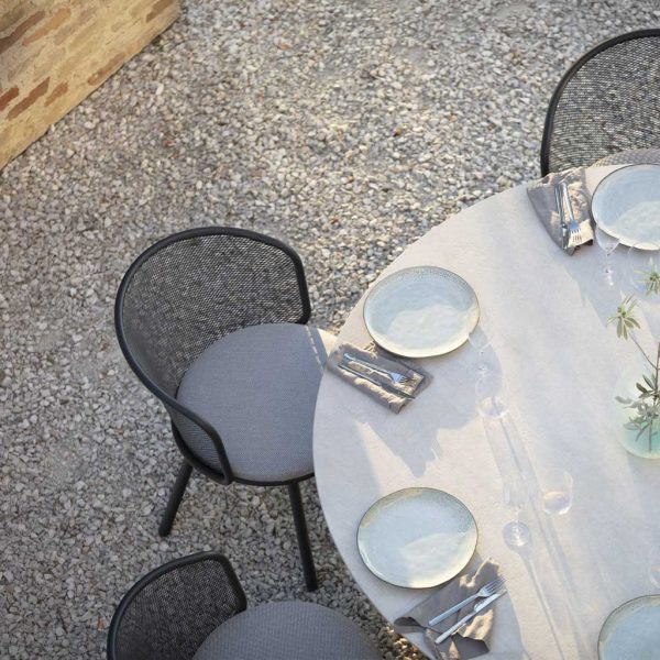 Birdseye view of Baza exterior dining chairs around Branta modern garden table