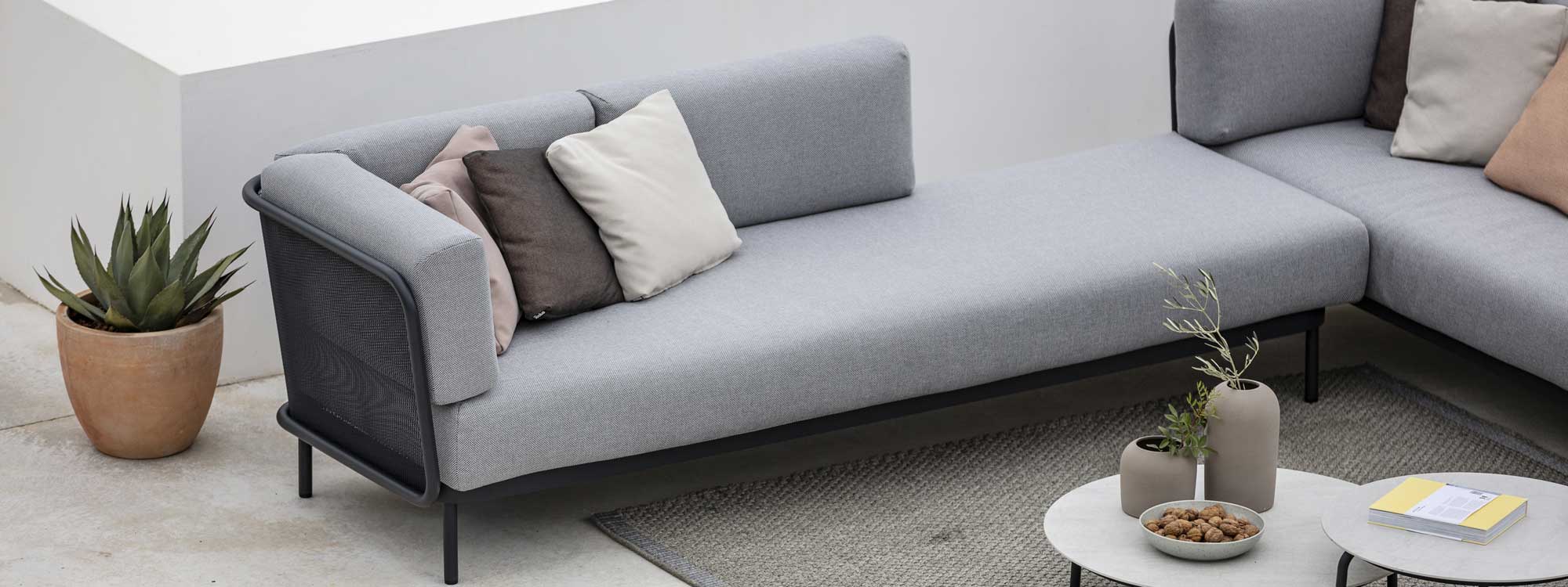 Image of Baza grey garden sofa and Starling ceramic low tables by Todus