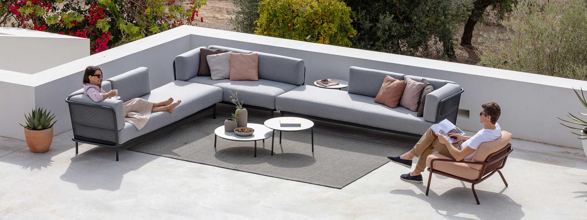 Baza garden corner sofa and Starling outdoor lounge chair & low tables by Todu