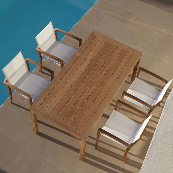 Birdseye image of XQI teak dining furniture next to swimming pool