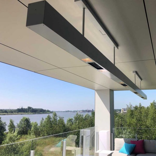Image of Heatsail Beem exterior ceiling heater with lights on, with large river in background